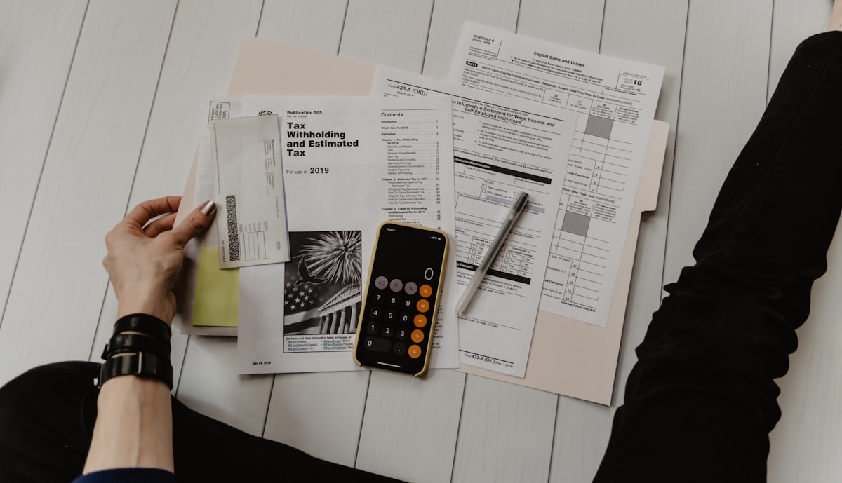 Property agent checking phone between viewings, responding to lead enquiry