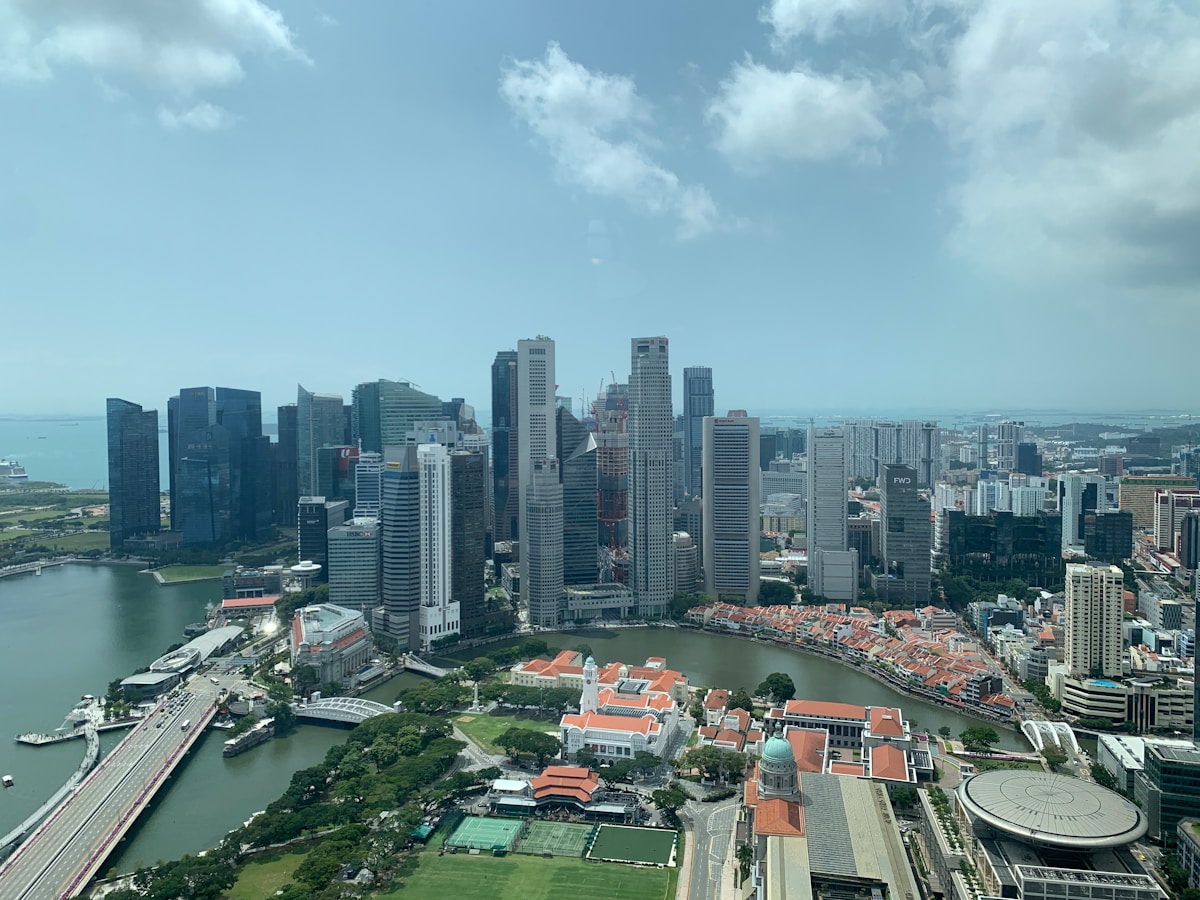 Aerial view of Singapore's CBD and Marina Bay area, one of the AI-adjacent zones expanding through 2028