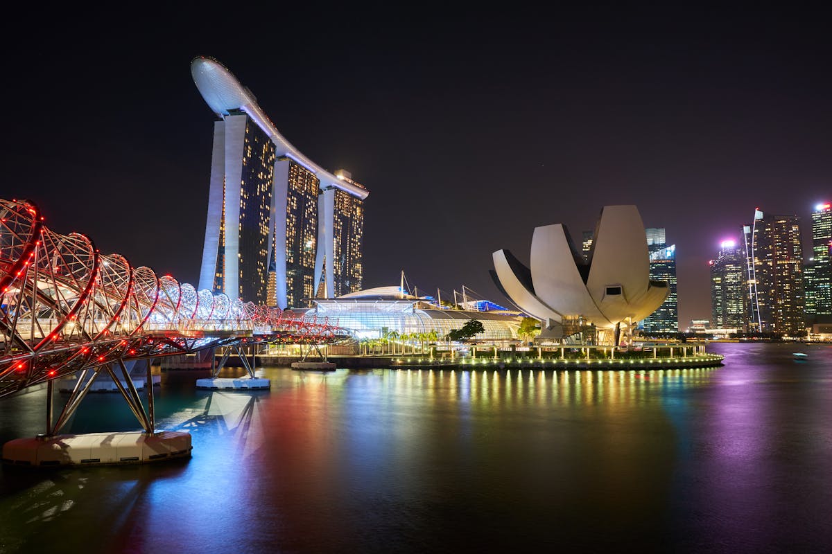 Singapore Marina Bay skyline at night representing the Singapore private residential property market context