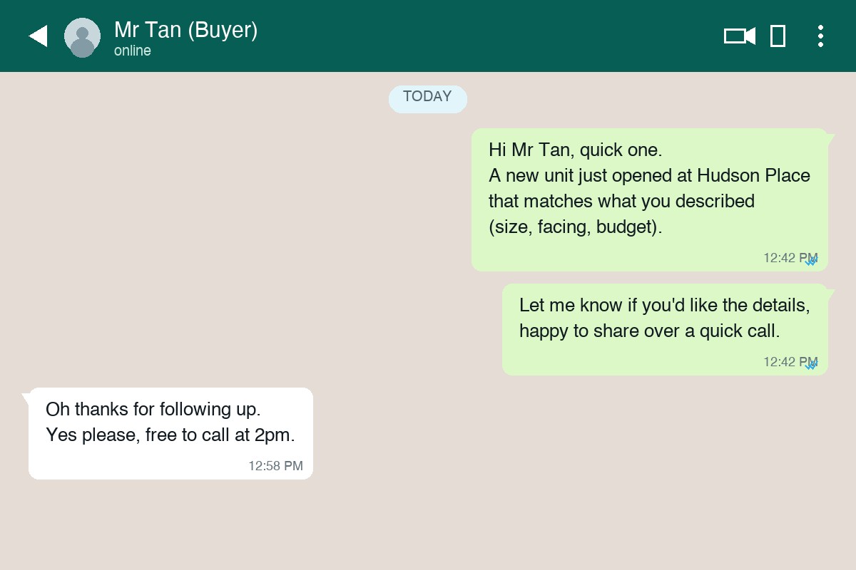 Close-up of a person's hands holding a smartphone and typing a message in a chat app, representing a property agent drafting a WhatsApp follow-up to a lead who stopped replying